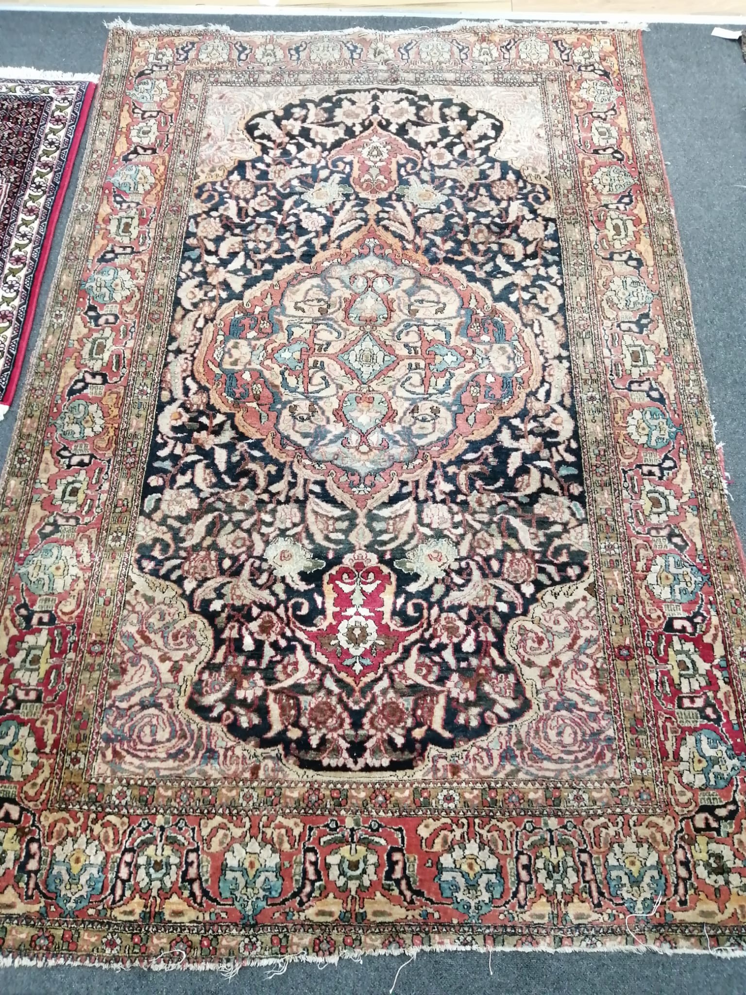 A North West Persian red ground rug, a Tabriz blue ground rug and two smaller modern rugs, largest 254 x 172cm